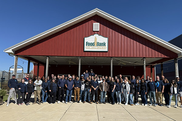 DSFG donates to Food Bank of Delaware - photo team in front of facility